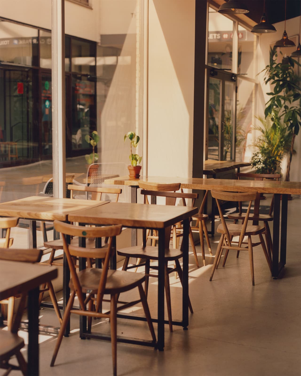 NKORA cafe tables in warm sunlight