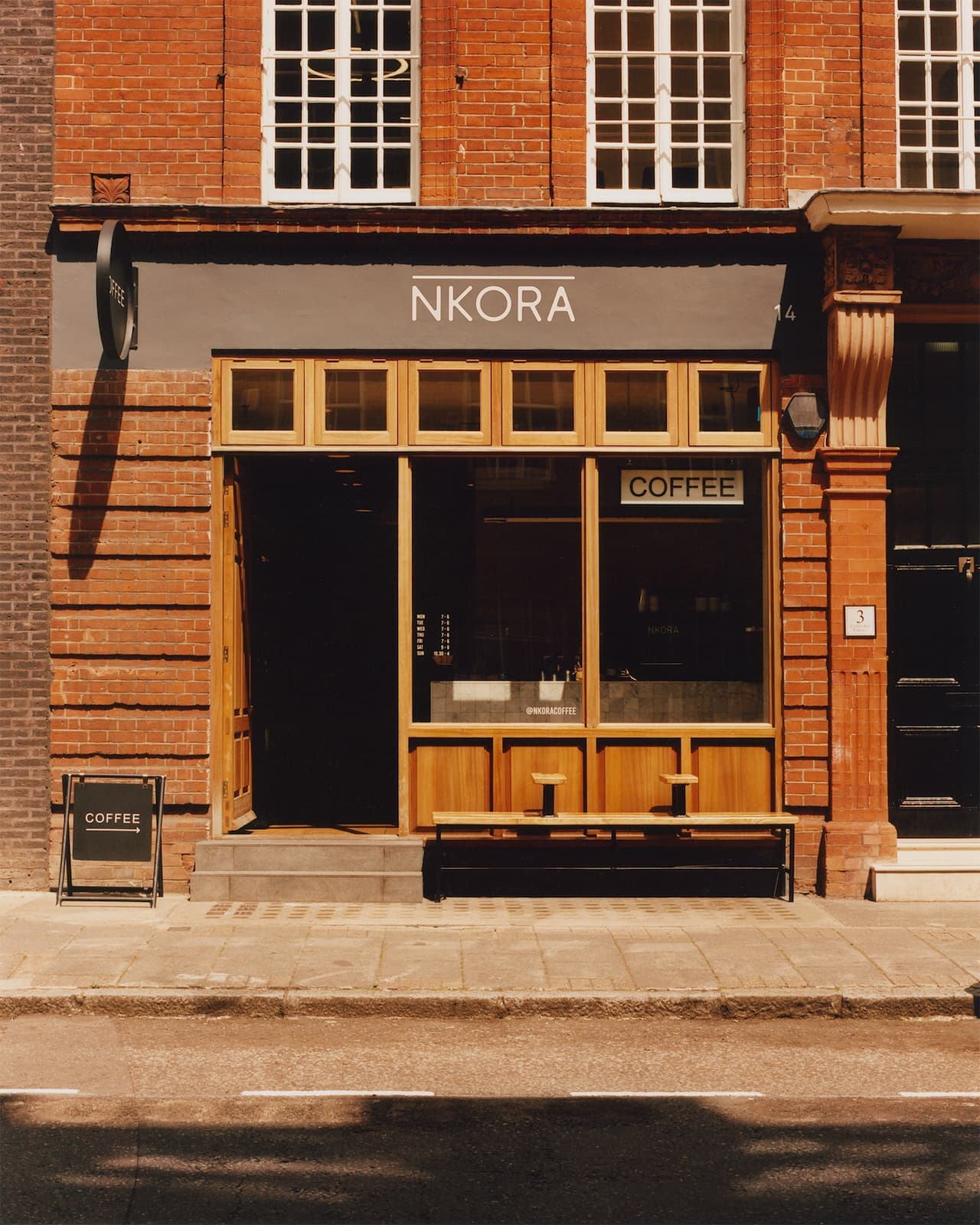 NKORA shopfront on a brick street